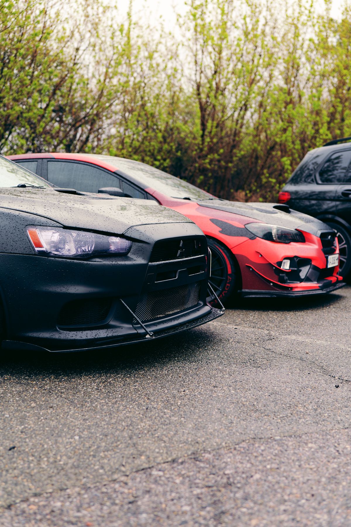 Modified sports cars with dark and red styling